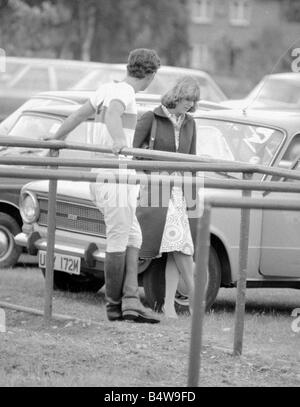 Prince Charles leans back on to railings as he chats with Camilla Parker Bowles during a break in a polo game at Windsor Great Park Royal Prince of Wales Sport Girlfriend June1975 1970s Mirrorpix Stock Photo