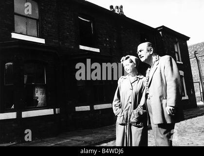 Jean Alexander actress who played Hilda Ogden in Coronation Street serial pictured with Bernard Youens her co star making a nostalgic visit in 1971 to Archie Street Salford Lancashire the original setting for Coronation Street to watch it being demolished Stock Photo