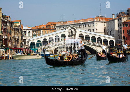 Taking a Gondola ride near the Rialto Bridge in Venice Italy. ( Add keyword TRAVELSHOTS  to search box to see 50 more shots.) Stock Photo