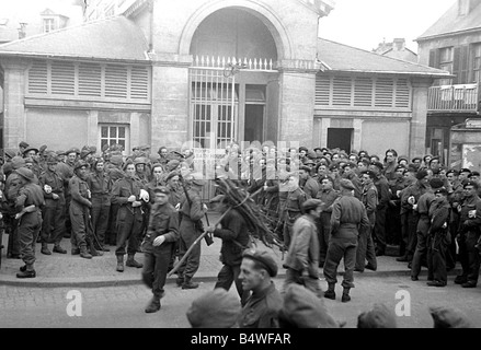 British troops outside the bath house in a Normandy town in Northern France shor tly after the D Day landings begun the Allied invasion of the continent during World War Two July 1944 Stock Photo