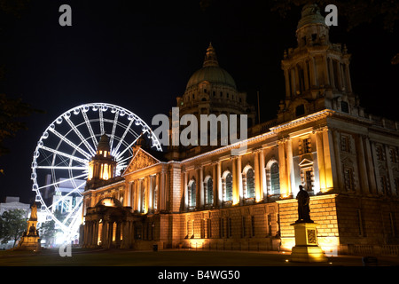 Belfast city hall and big wheel at night belfast northern ireland uk Stock Photo