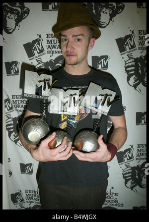 American pop star Justin Timberlake at the MTV Europe Awards 2003 being held in Edinburgh Scotland Pictured holding the three awards he won tonight Best Male Best Pop and Best Album Categories November 2003 Stock Photo