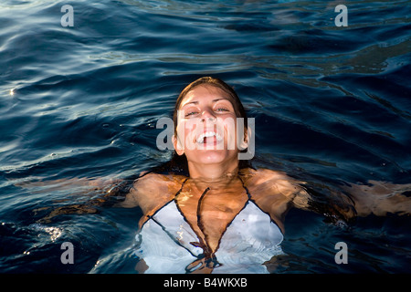 Young woman in water smiling Stock Photo