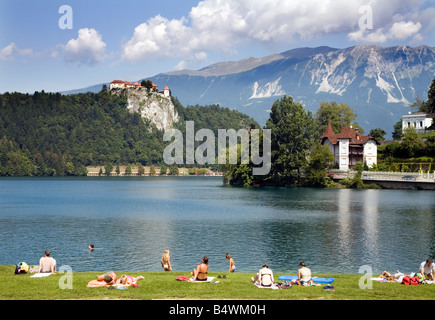 Lake Bled Republic of Slovenia Europe People bathing and sunning on the banks of the lake Stock Photo