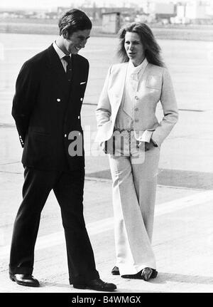 Princess Anne with her brother Prince Charles the Prince of Wales at Londons Heathrow Airport as they wait to fly to Balmoral in Scotland May 1973 Stock Photo