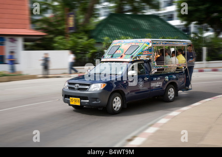 Traditional “Tuktuk” taxis, Shared Mobile open-air, passenger vehicle, Baht Bus, Songthaew, Tuk-Tuk, or Taxi,  Advertising Pattaya, Thailand. Stock Photo