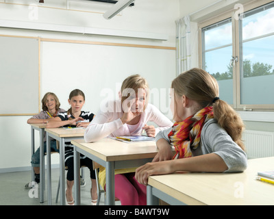 Four students in a classroom Stock Photo