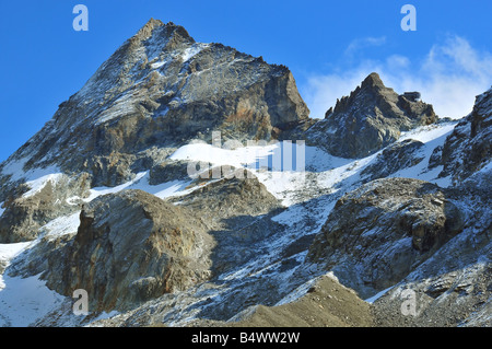 Bertol Mountain refuge in Switzerland under a fresh layer of aytumn snow. Stock Photo