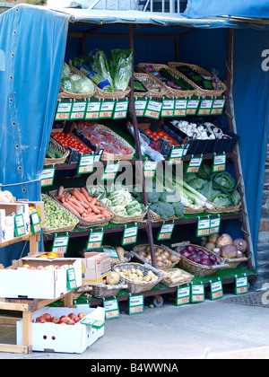 Fruit and vegetables on display outside a green grocers in Stock Photo