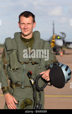 Jet fighter pilot in his flying suit from Sweden standing in front of a Saab JAS 39 Gripen aircraft - EDITORIAL USE ONLY Stock Photo