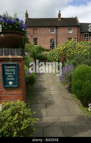 City of Lichfield, England. The Erasmus Darwin Herb Garden located at Darwin Close with Darwin’s house in the background. Stock Photo