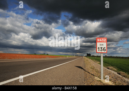 Straight high quality fast tarmac road with white line markings at Km 136 on the N432 east of Llerena Extremadura Spain Stock Photo