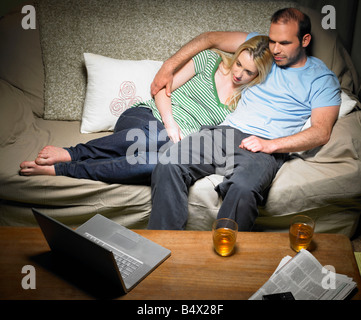 Young couple watching a movie Stock Photo