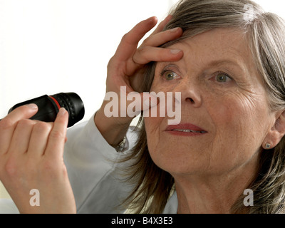 Doctor examining mature woman