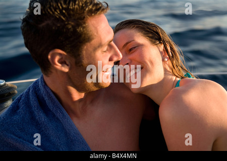 Couple on boat looking at each other Stock Photo