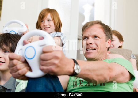 Father driving virtual with a wheel Stock Photo
