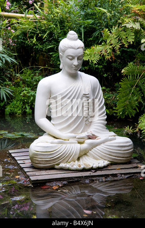 asian style female statue in tropical garden, gardone, lake garda, italy Stock Photo