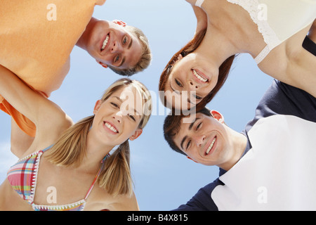 Low angle view of friends in a huddle Stock Photo