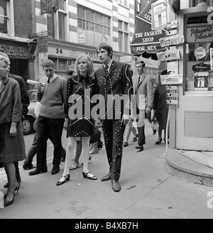 Carnaby Street London was a fashion mecca in the 1960s This image shows how the trendy youths of that time preferred to dress 2nd October 1966 Stock Photo