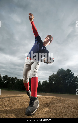 Baseball pitcher throwing ball Stock Photo