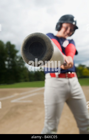 Baseball player swinging bat Stock Photo