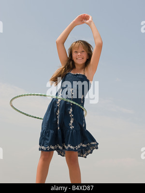 Girl hula hooping Stock Photo