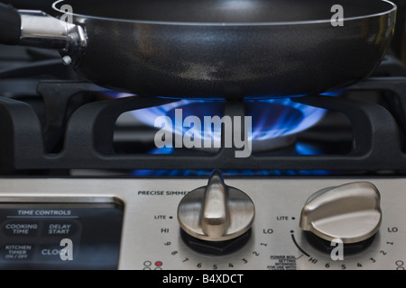 Close up of skillet on gas stove Stock Photo