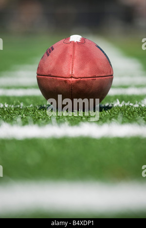 Close up of football on yard line marker Stock Photo