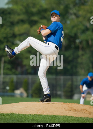 Baseball pitcher preparing to pitch ball Stock Photo