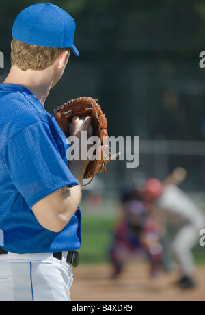 Baseball pitcher preparing to pitch ball Stock Photo