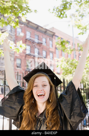 Female graduate celebrating Stock Photo