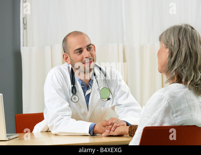 Doctor consulting mature woman Stock Photo