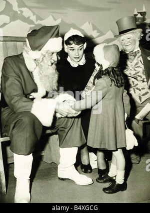 Audrey Hepburn November 1950 Father Christmas and Uncle Holly have a new assistant in Lovely 21years old Audrey Hepburn who is making her screen debut in the Associated British comedy Laughter in Paradise Stock Photo