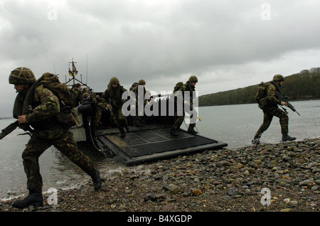 Royal Marine Recruits November 2006 who are taking part in his final excercise with fellow recruits in pembroke wales where they practised a beach assault before the night time excercise Once the marines pass their final test and pass out as a full marine commando they will get their green beret November 2006 Stock Photo