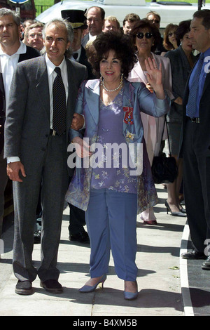 Dame Elizabeth Taylor complete with her medal May 2000 pinned to her after the Queen made her a Dame of the Order of The British Empire at Buckingham Palace with Michael Wilding jnr Stock Photo