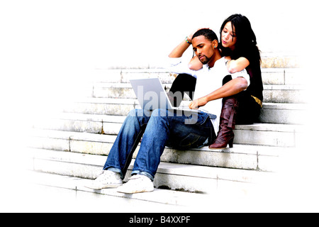 Young couple using laptop Stock Photo