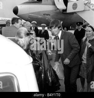 John Lennon with wife Cynthia and Ringo Starr with Maureen arriving at ...