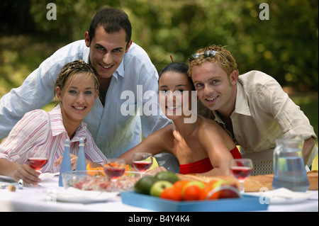 Group of friends having summer lunch Stock Photo