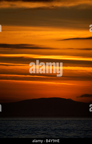 sunset over the fanad peninsula of county donegal republic of ireland as seen from portstewart county londonderry ireland Stock Photo