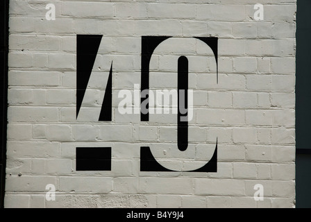 Number 40 painted on a white brick wall Stock Photo
