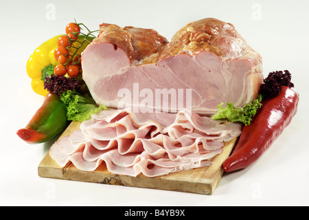 baked speck isolated on cutting board Stock Photo