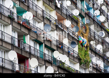 Many satellite dishes fixed to balconies of apartment building built as social housing at Pallasstrasse in Schoneberg Berlin Stock Photo