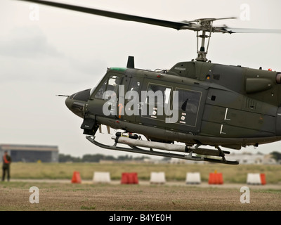 Military Huey UH1 N helicopter take off Stock Photo