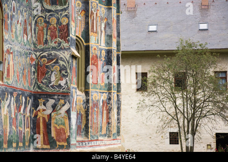 Painted church wall in fortified Sucevita Monastery compound grounds. Bucovina Moldavia Romania Europe Stock Photo
