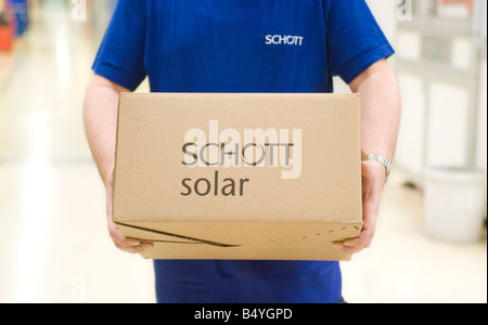 SCHOTT Solar AG production of solar cells Worker with packaged solar cells ready for shipping Stock Photo