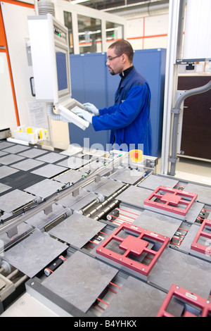SCHOTT Solar AG production of solar cells Worker controlling the production process of the wafers at a computer Stock Photo