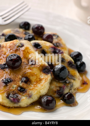Plate Of Blueberry Pancakes With Maple Syrup Stock Photo