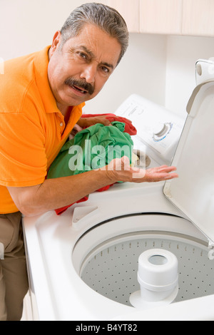 Man Doing Laundry Stock Photo