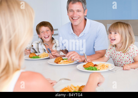 Family Eating A Meal Together Stock Photo