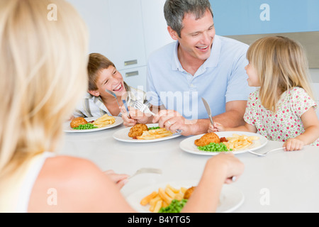 Family Eating A Meal Together Stock Photo